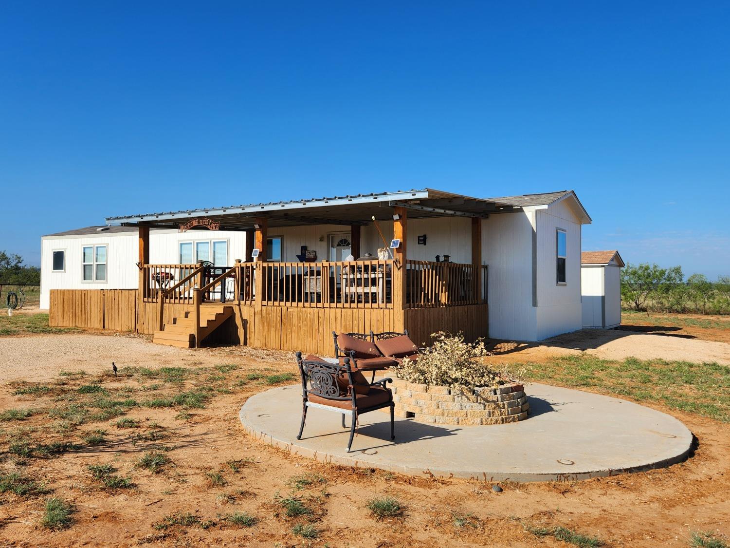 a view of a house with backyard porch and patio