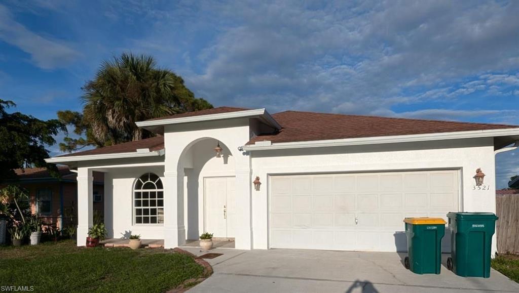 View of front of property featuring a garage