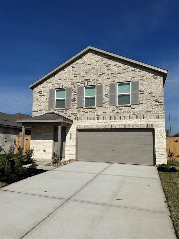 a front view of a house with a garage