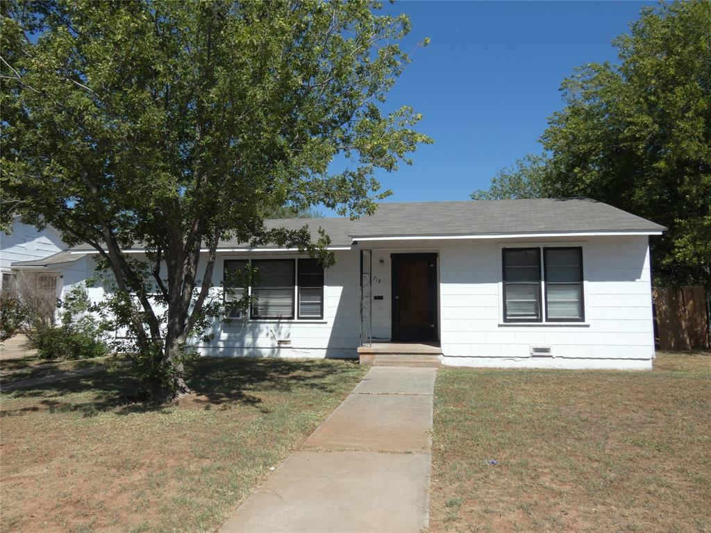 a front view of a house with yard