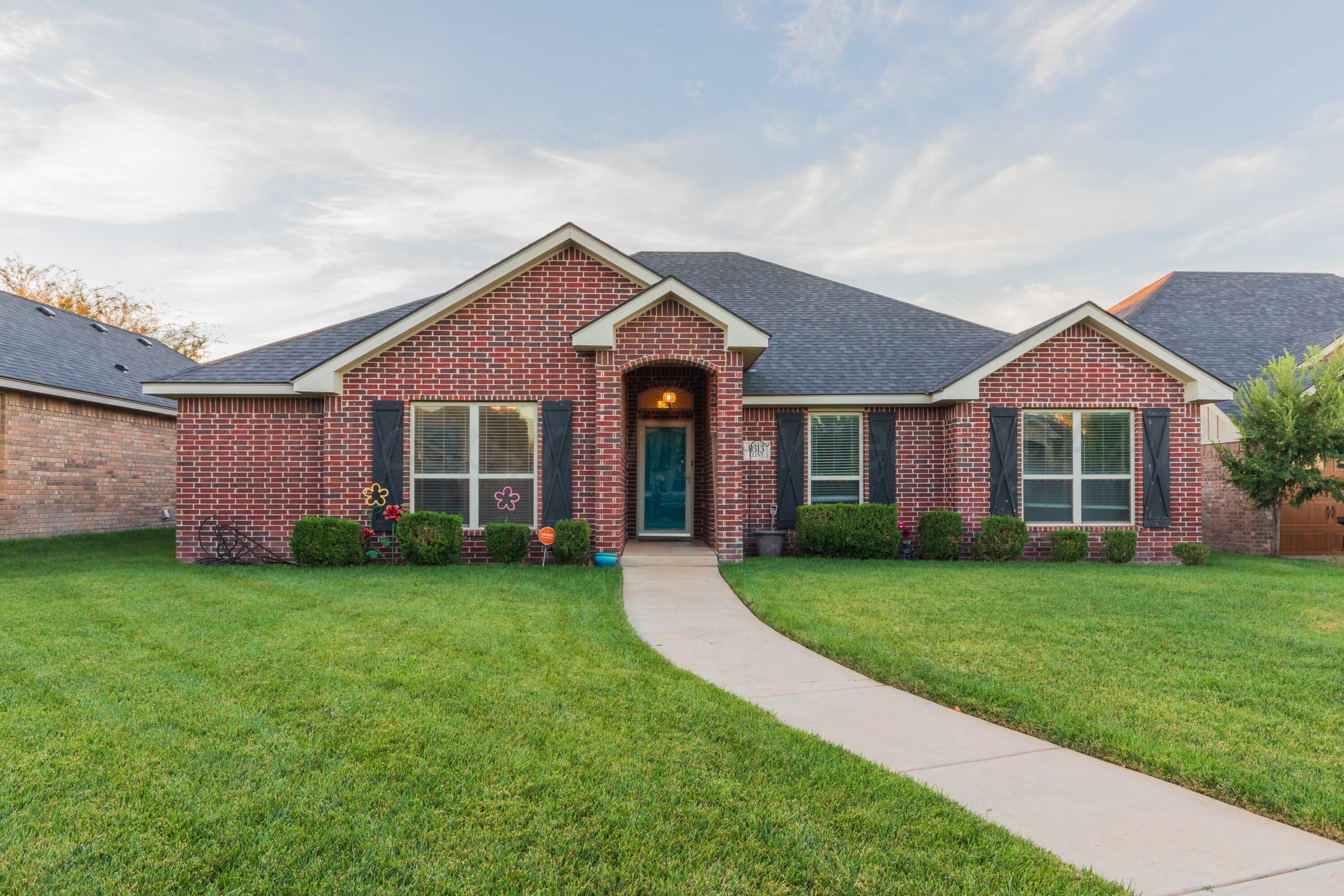 front view of a house with a yard