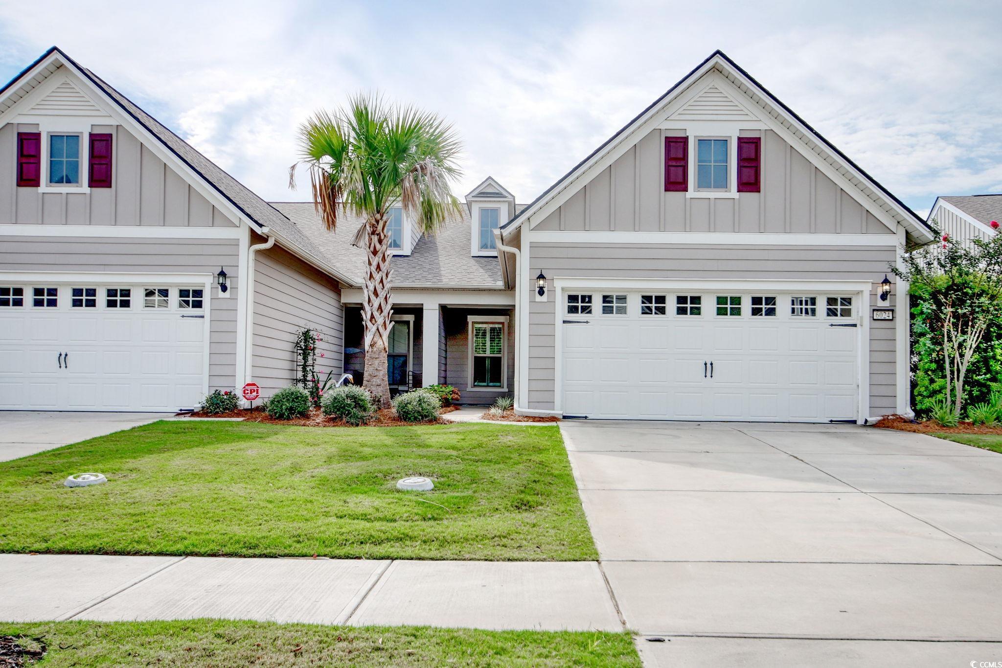 Craftsman-style house featuring a front lawn and a