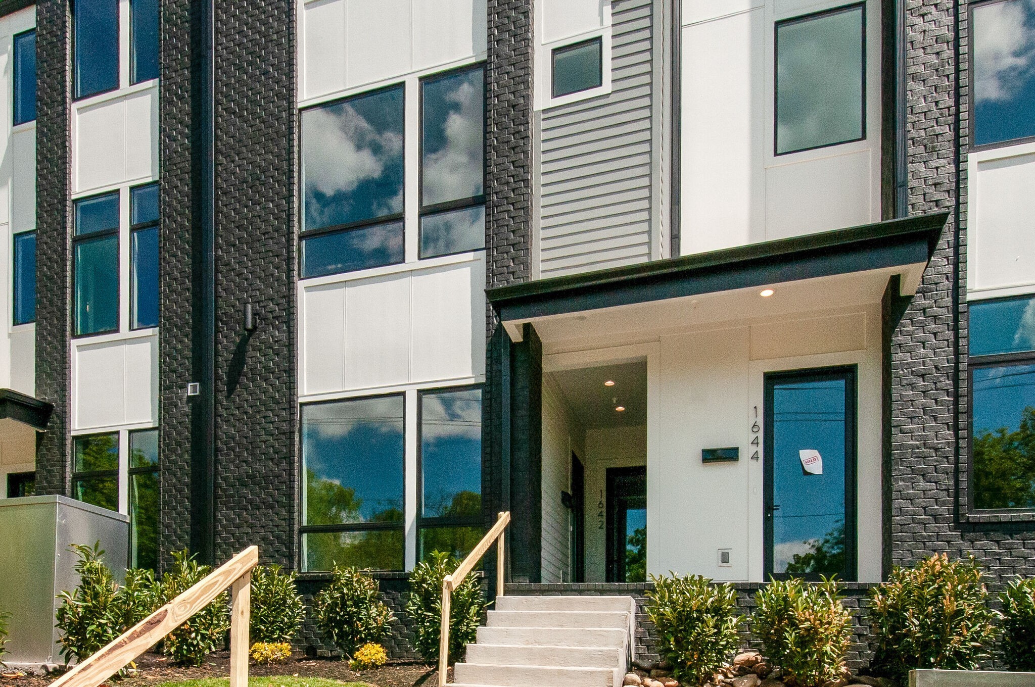 a view of building with glass windows and door