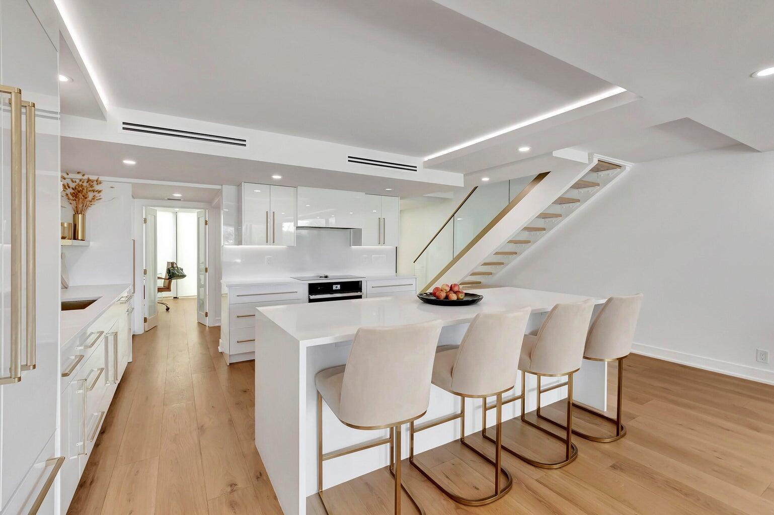 a view of kitchen with furniture and wooden floor