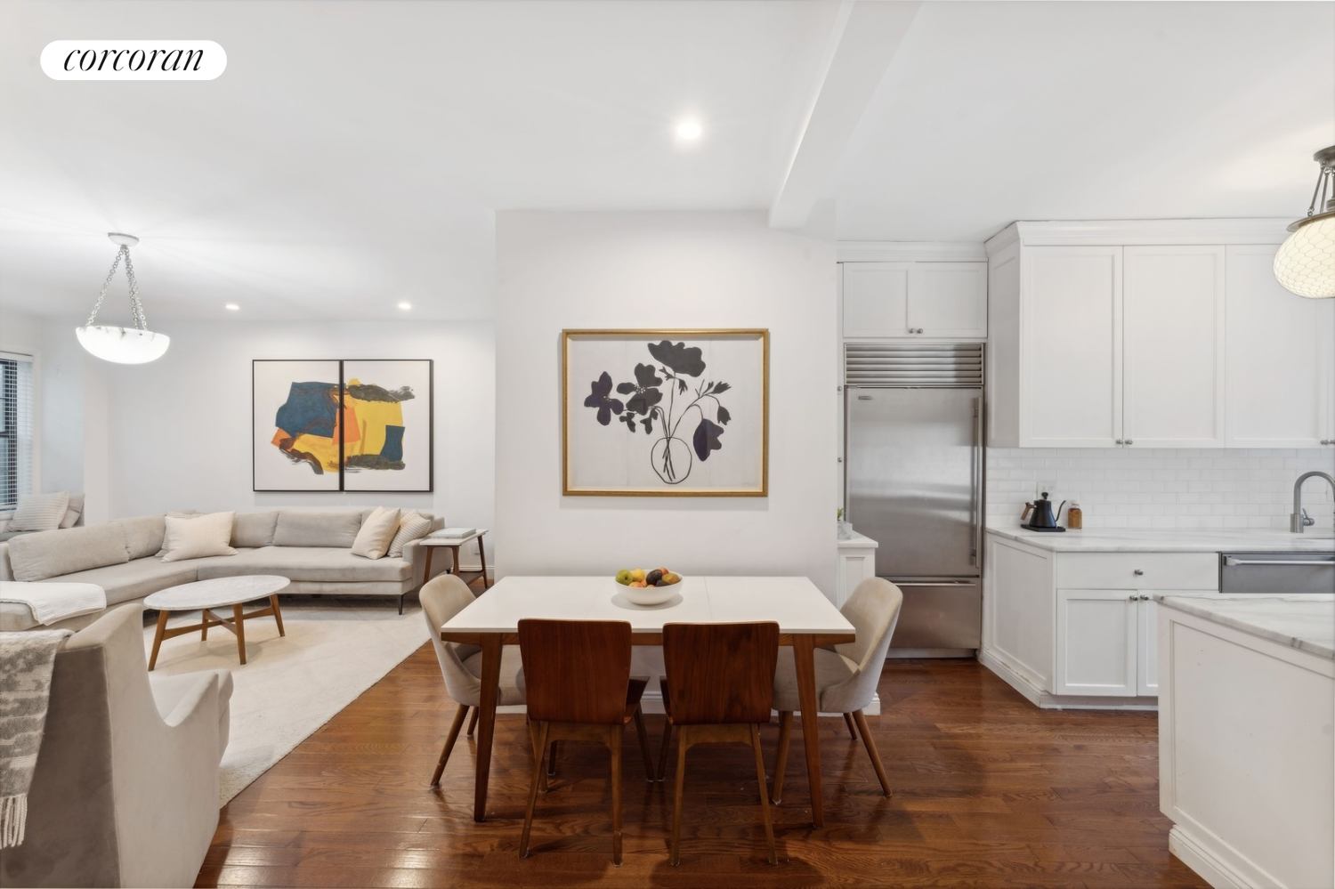 a view of a dining room with furniture and wooden floor