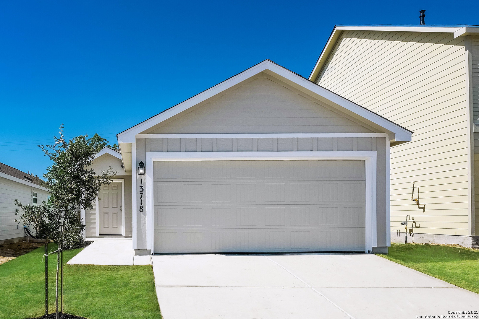 a front view of a house with a yard