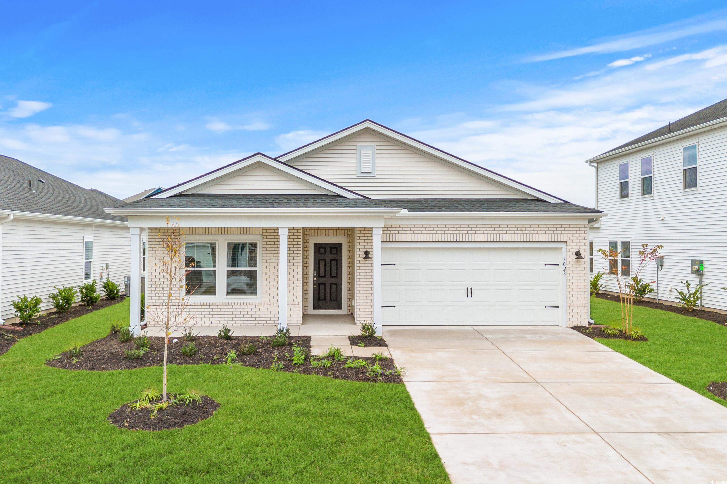 View of front of home featuring a front yard and a