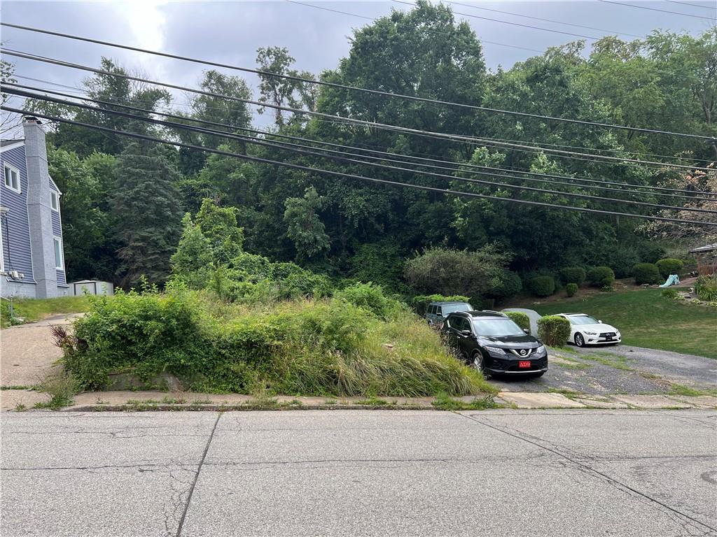 a view of a car parked on the side of a road