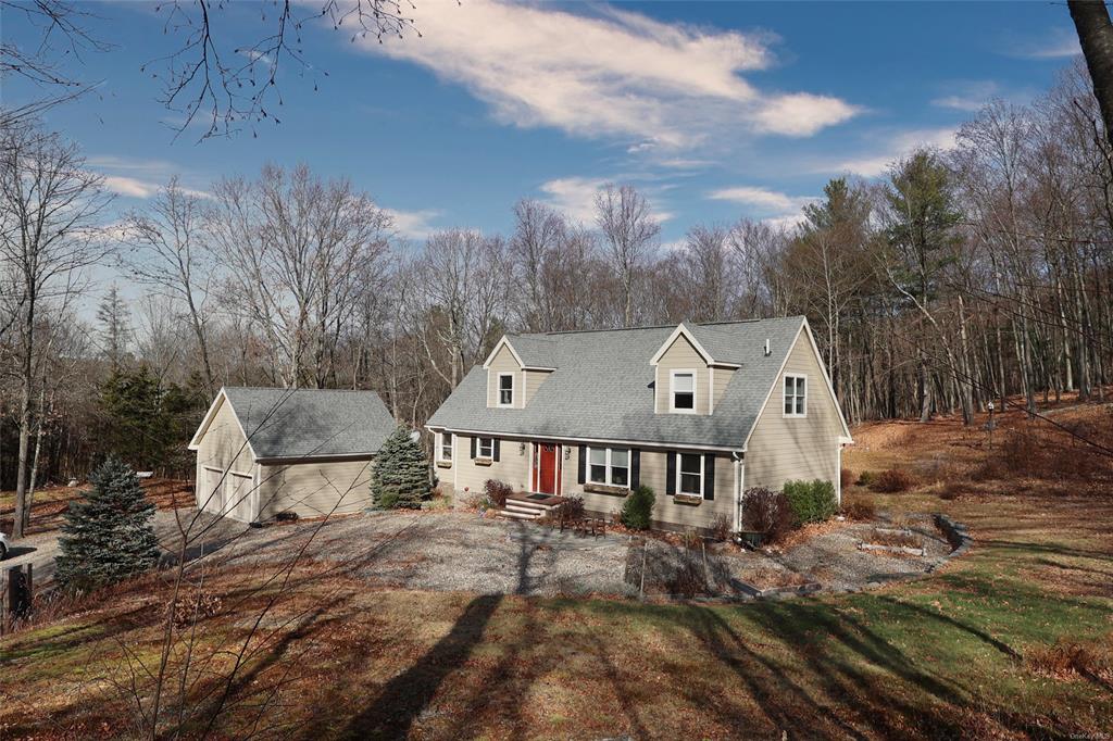 New england style home with a front yard