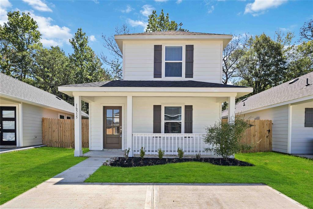 front view of a house with a yard