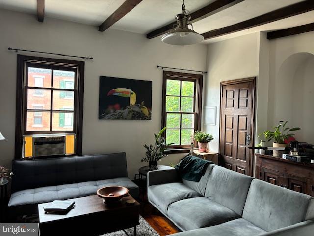 a living room with furniture and a window