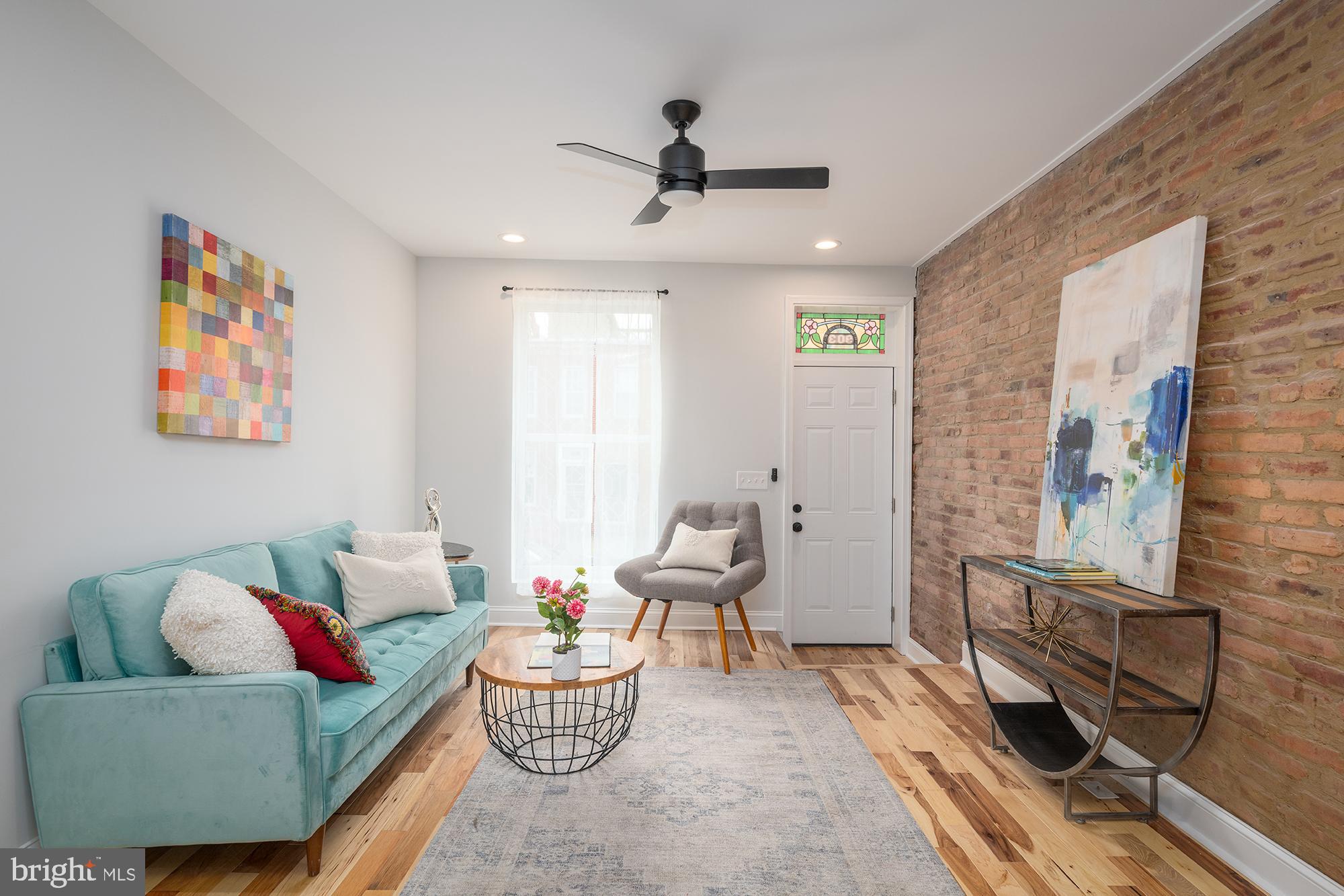 a living room with furniture and a window