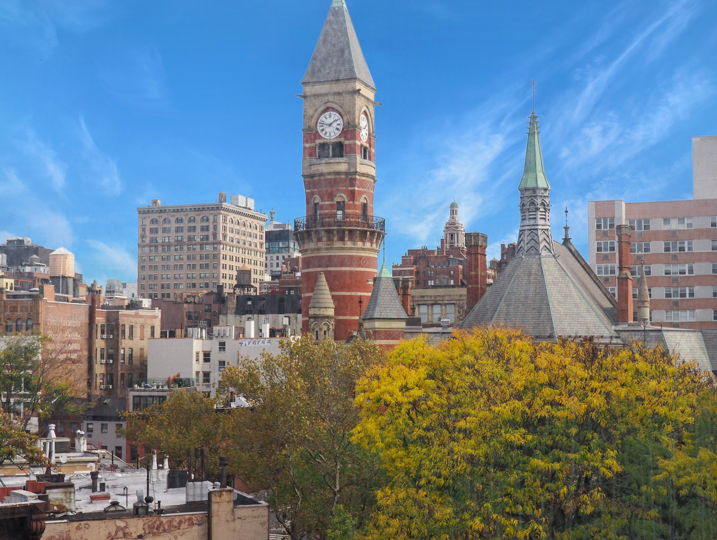 a view of a city with tall buildings