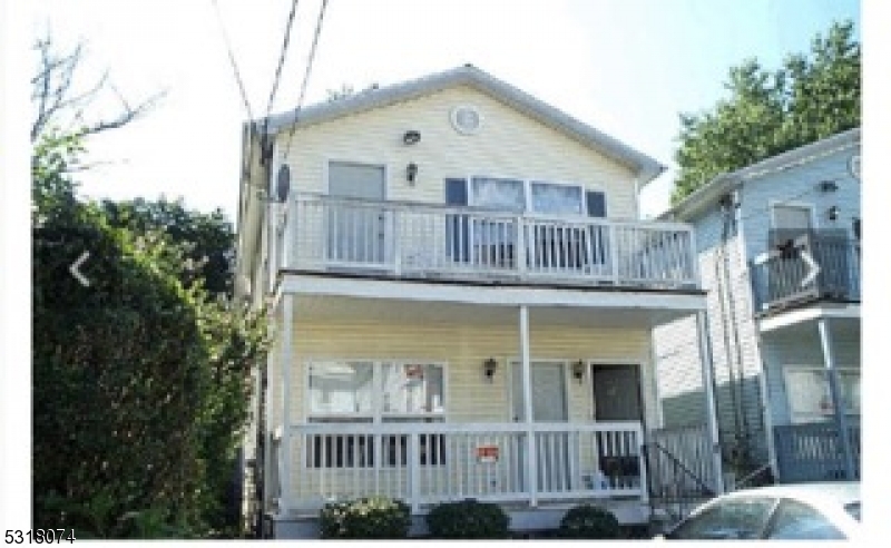 a front view of a house with balcony