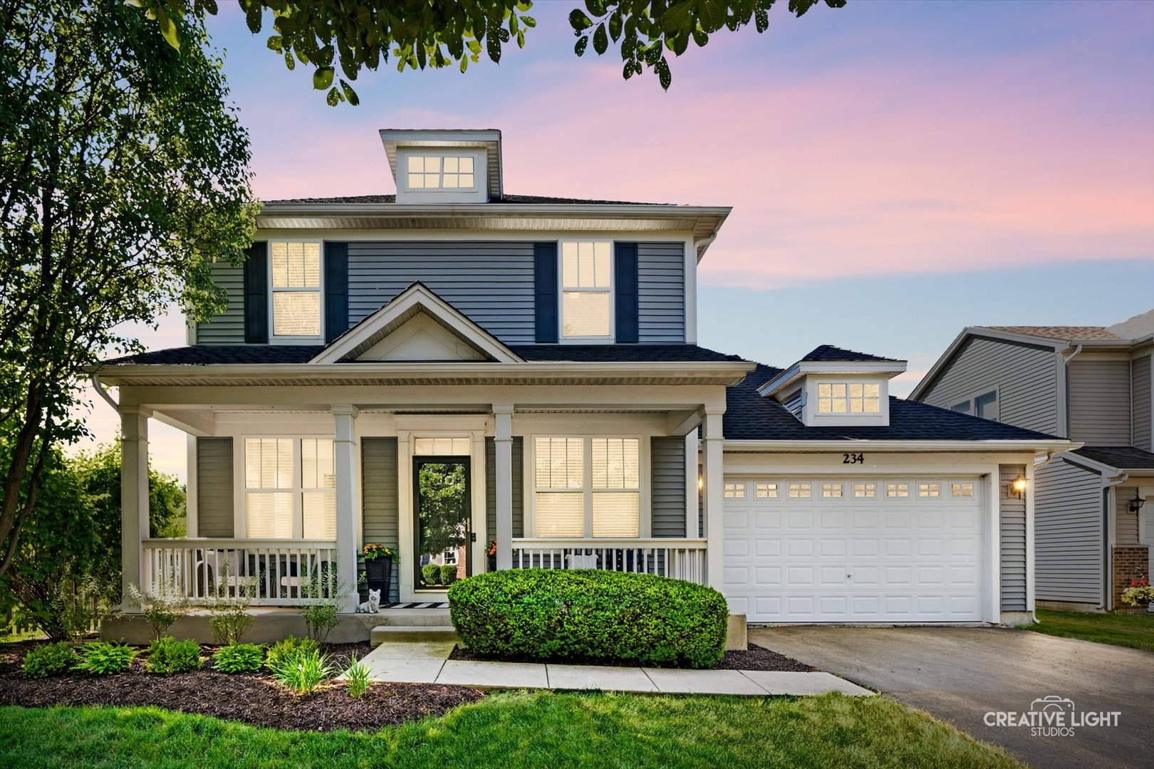 front view of a house with a yard