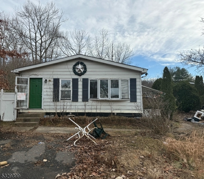 a house with trees in the background