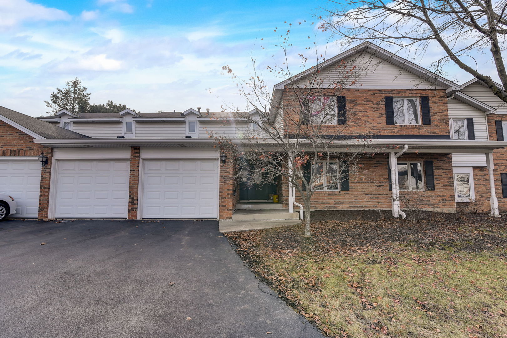 a front view of a house with a garage