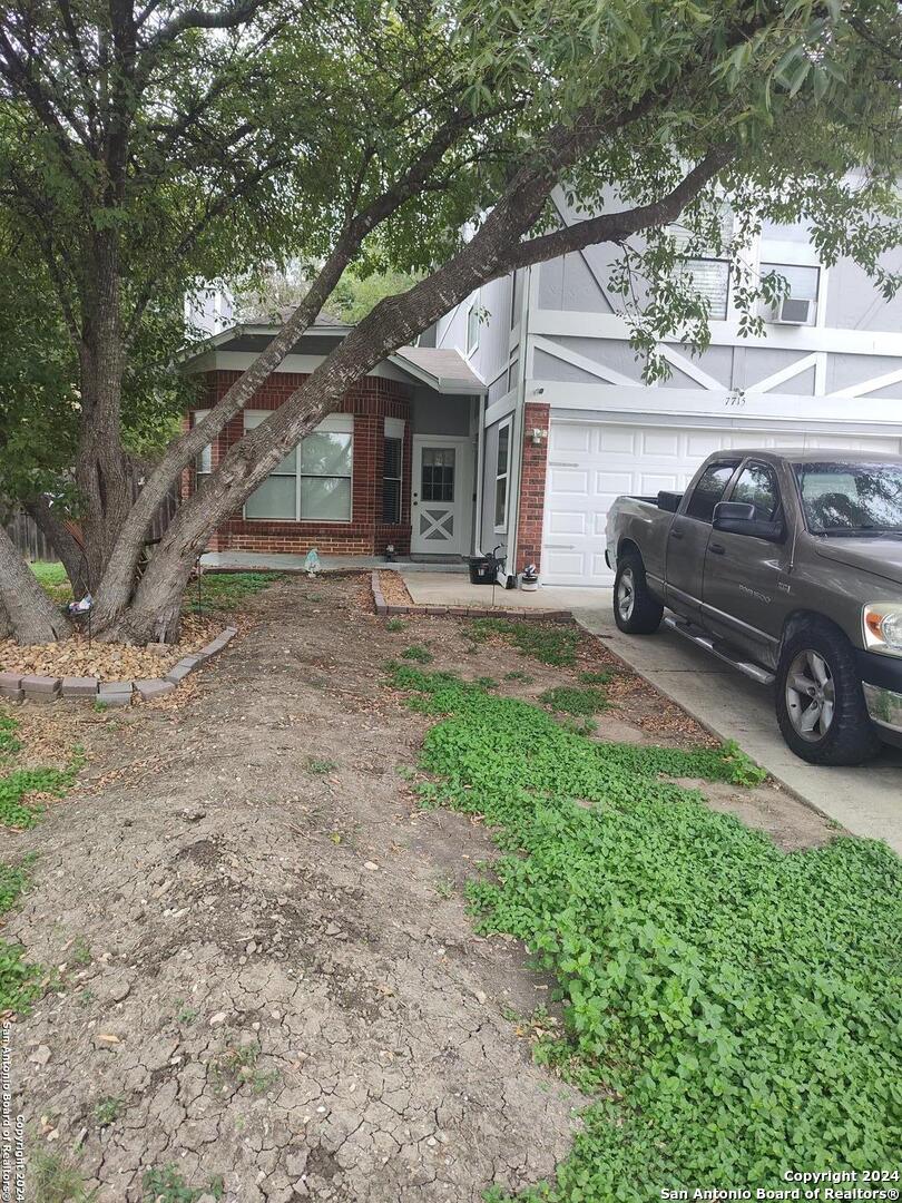 a view of a car parked in front of a house