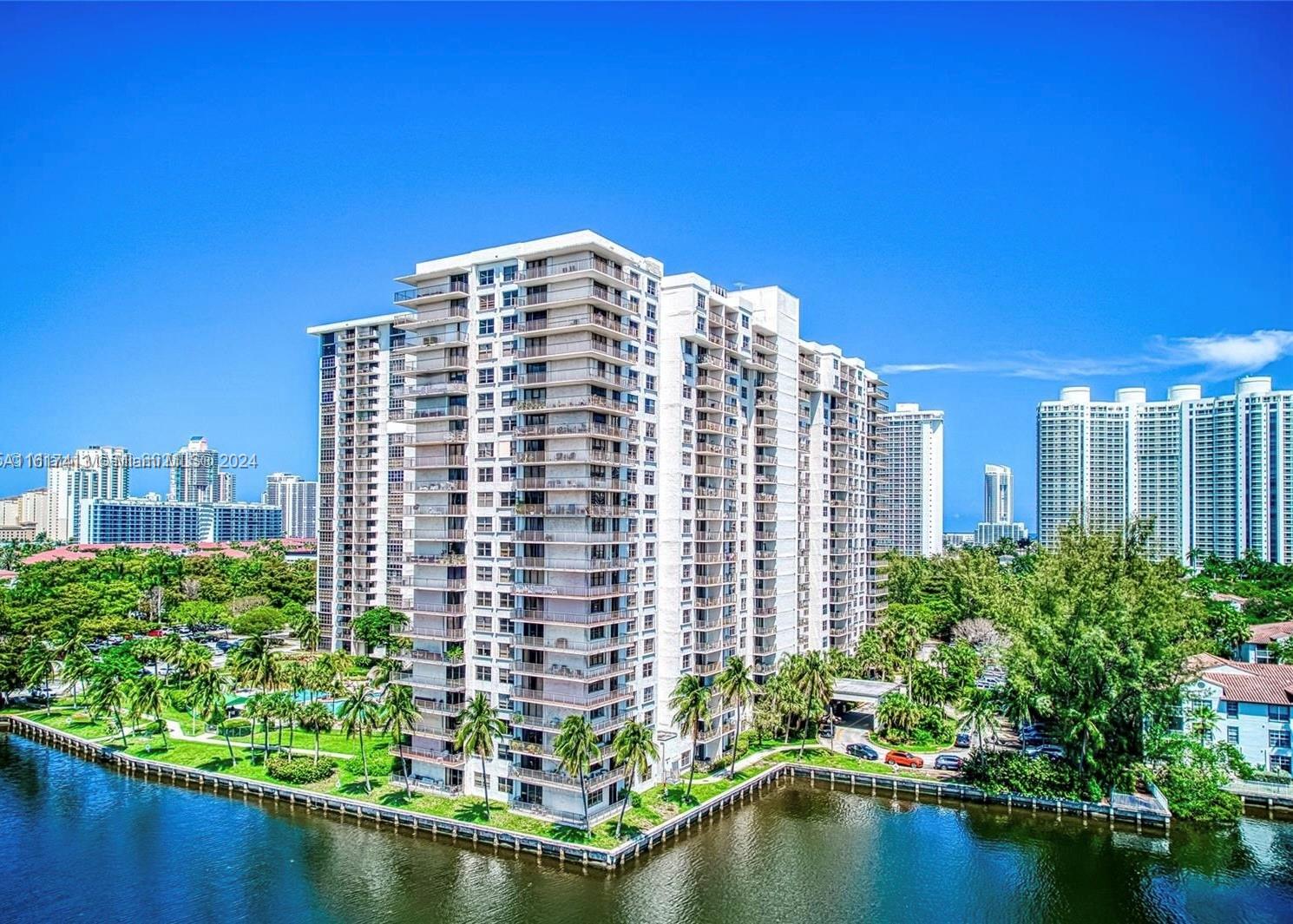 a view of a tall building and a lake view