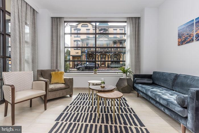 a living room with furniture and a window