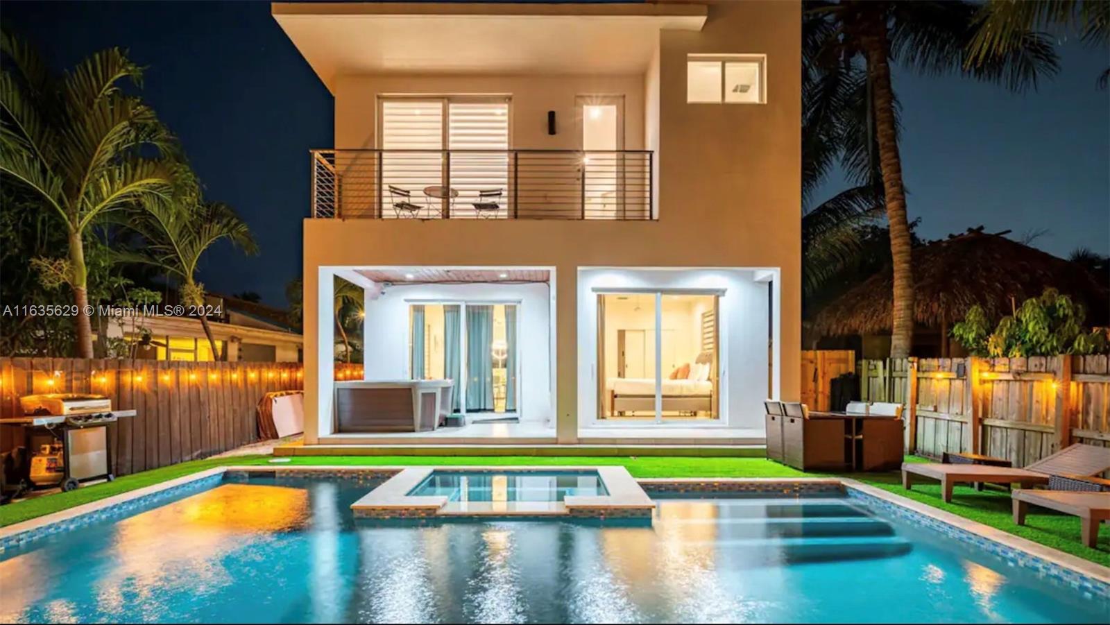 a view of a swimming pool with an outdoor seating