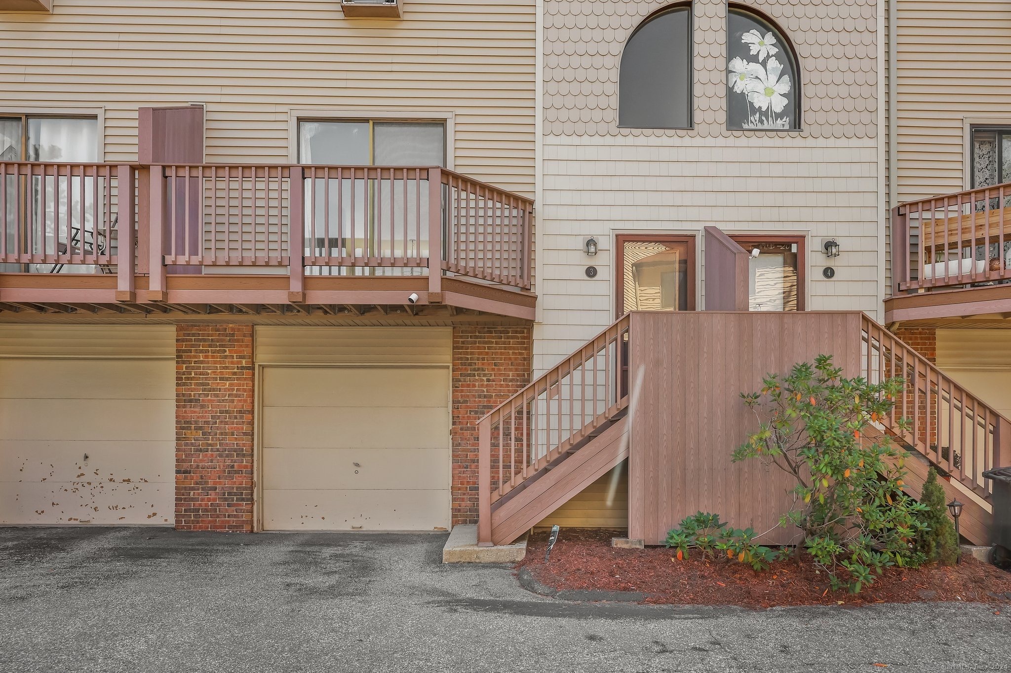 a view of a house with a yard and deck