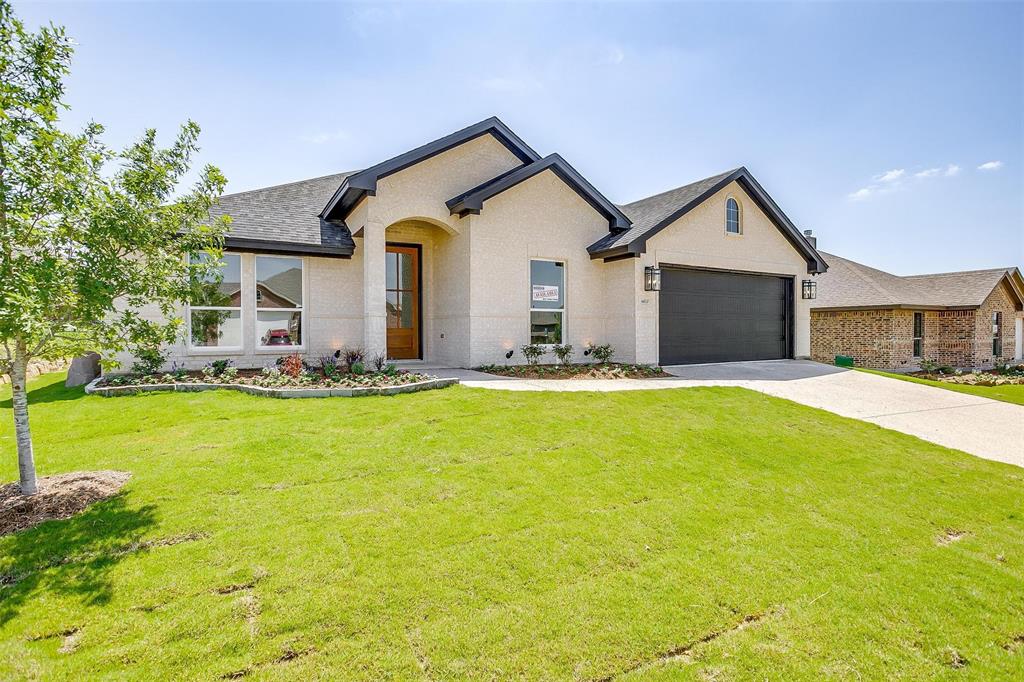 a front view of house with yard and seating area