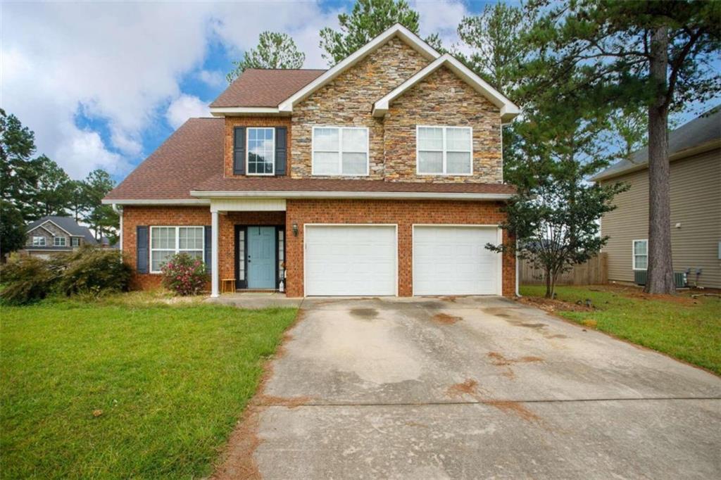 front view of a house with a yard