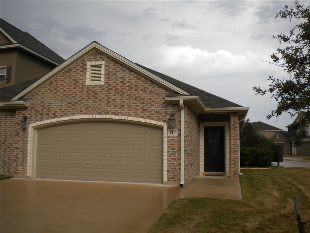 a front view of a house with garage