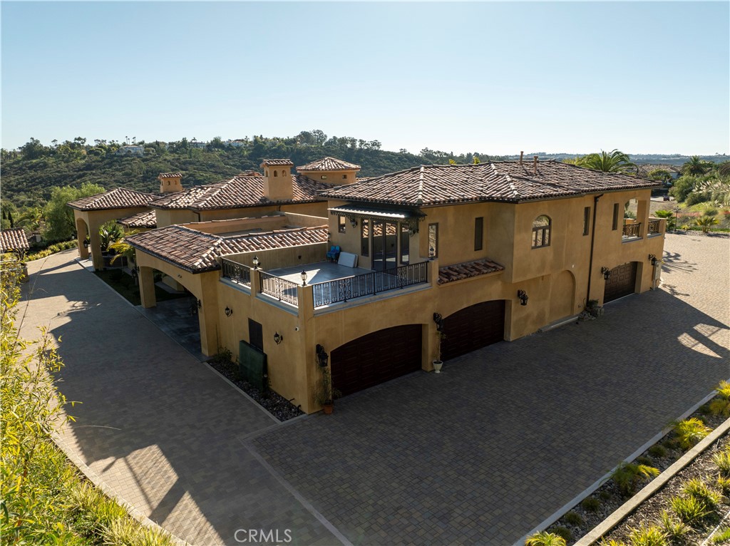 Aerial view of side of residence facing three (2 each) car garages