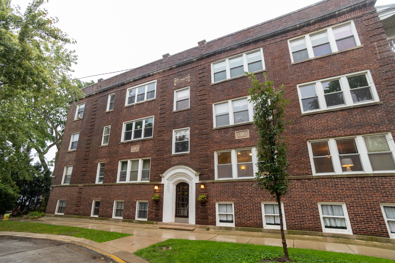 a front view of a building with garden