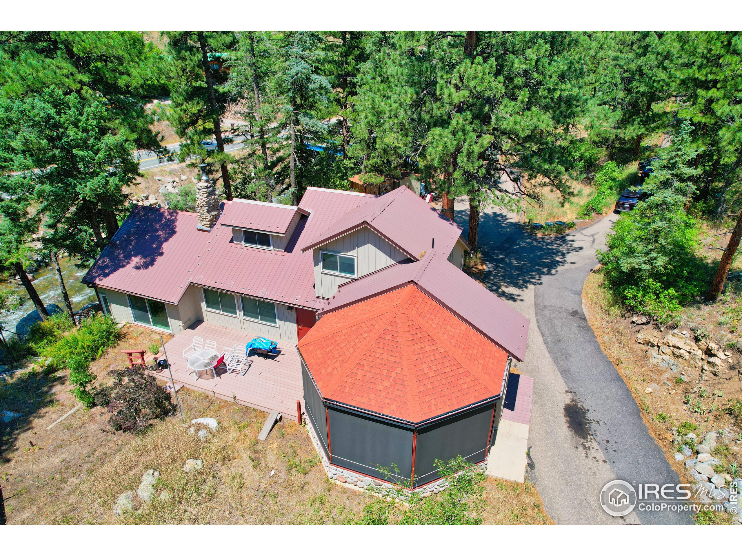 an aerial view of a house with a swimming pool outdoor seating and entertaining space