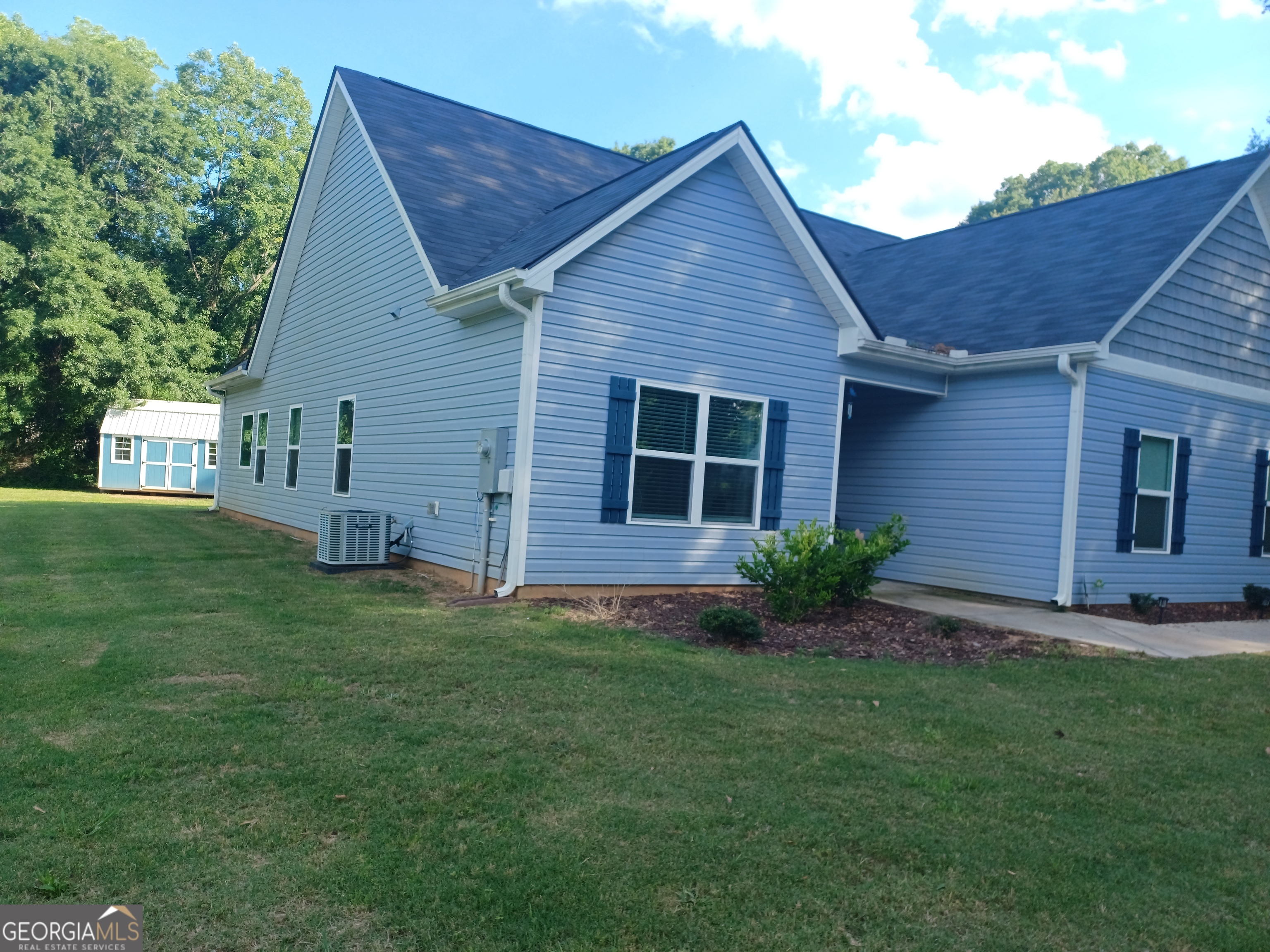 a view of a back yard of the house