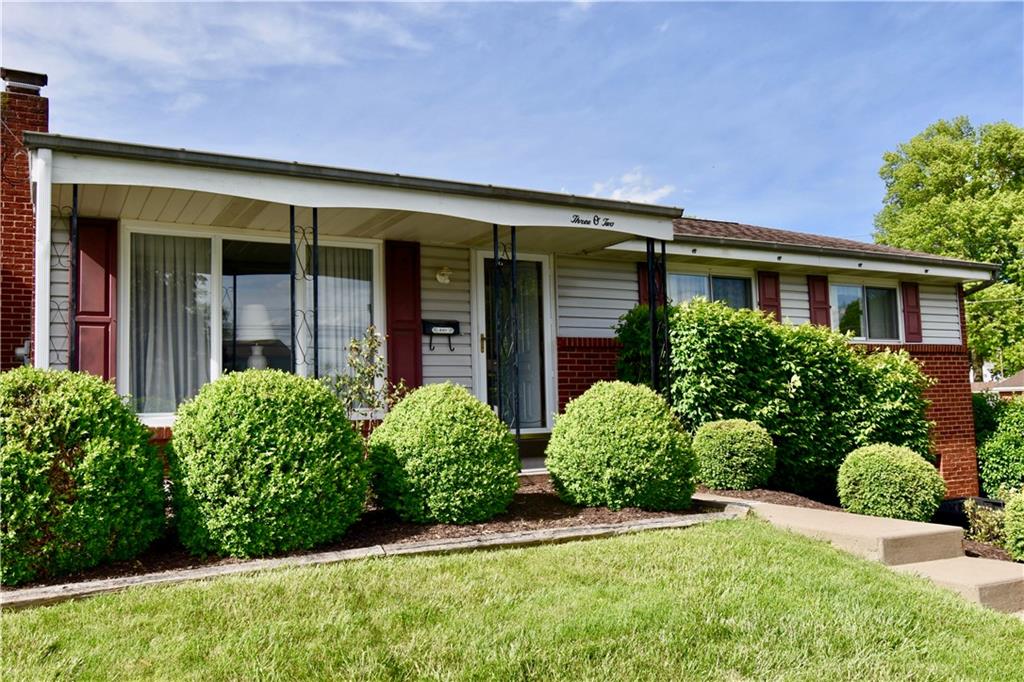 front view of a house with a yard