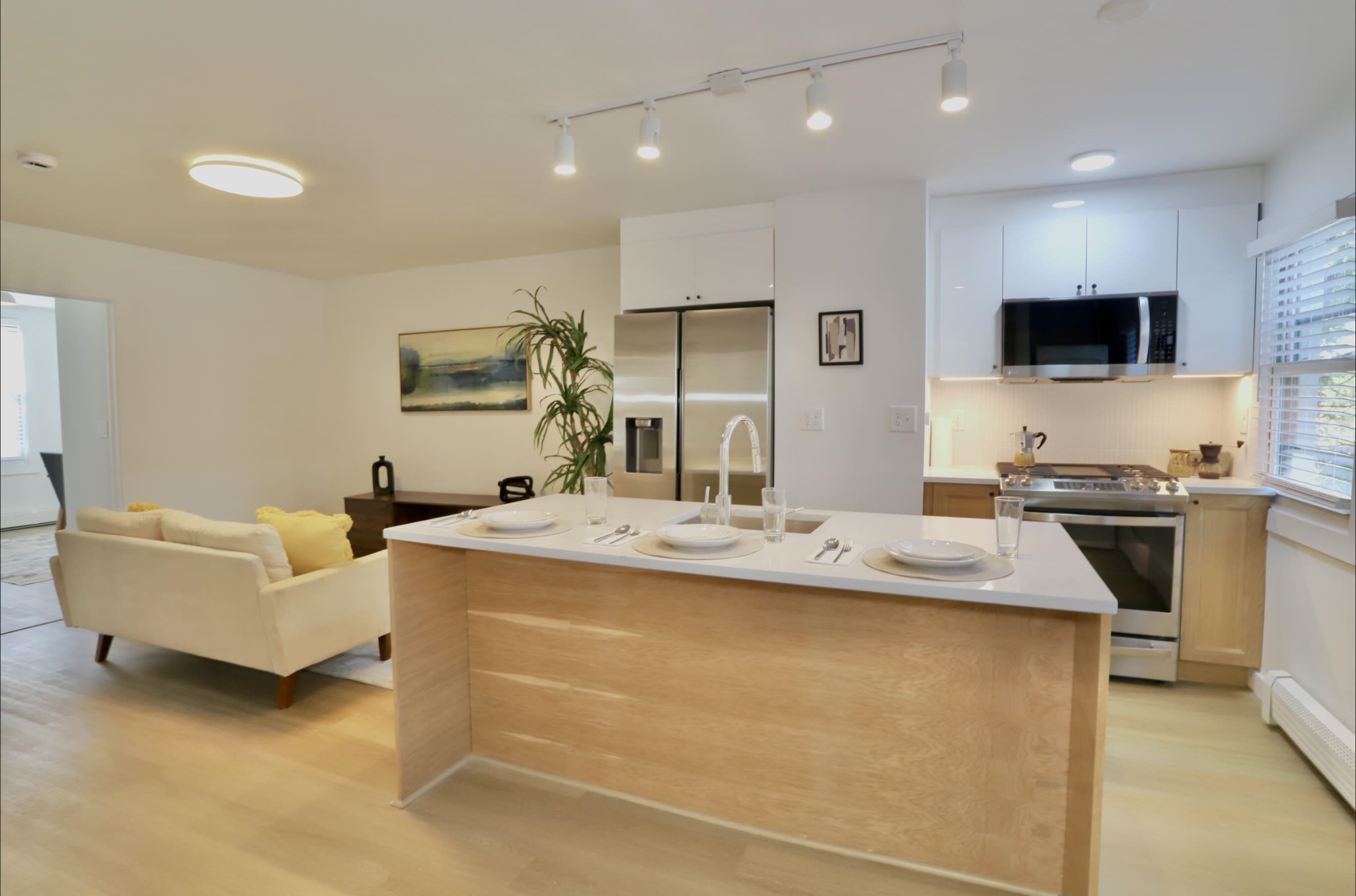 a kitchen with counter top space and stainless steel appliances