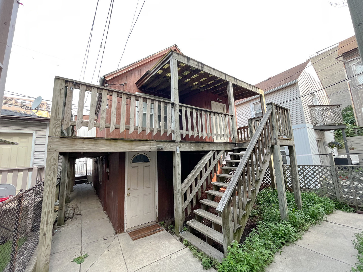 a view of a house with wooden deck