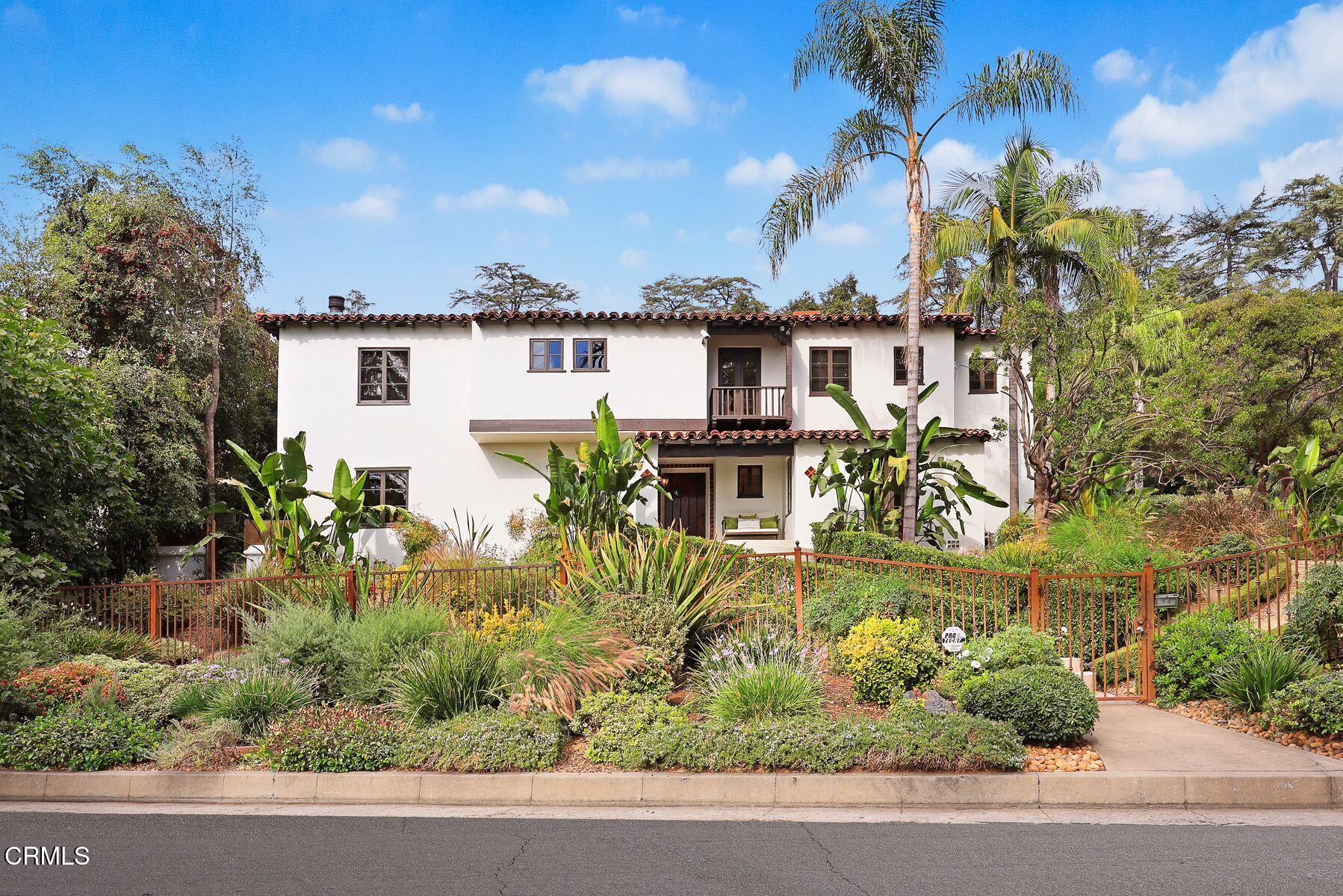 a view of a house with a yard and plants