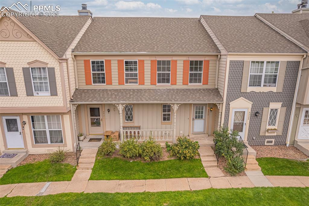 a front view of a house with a yard