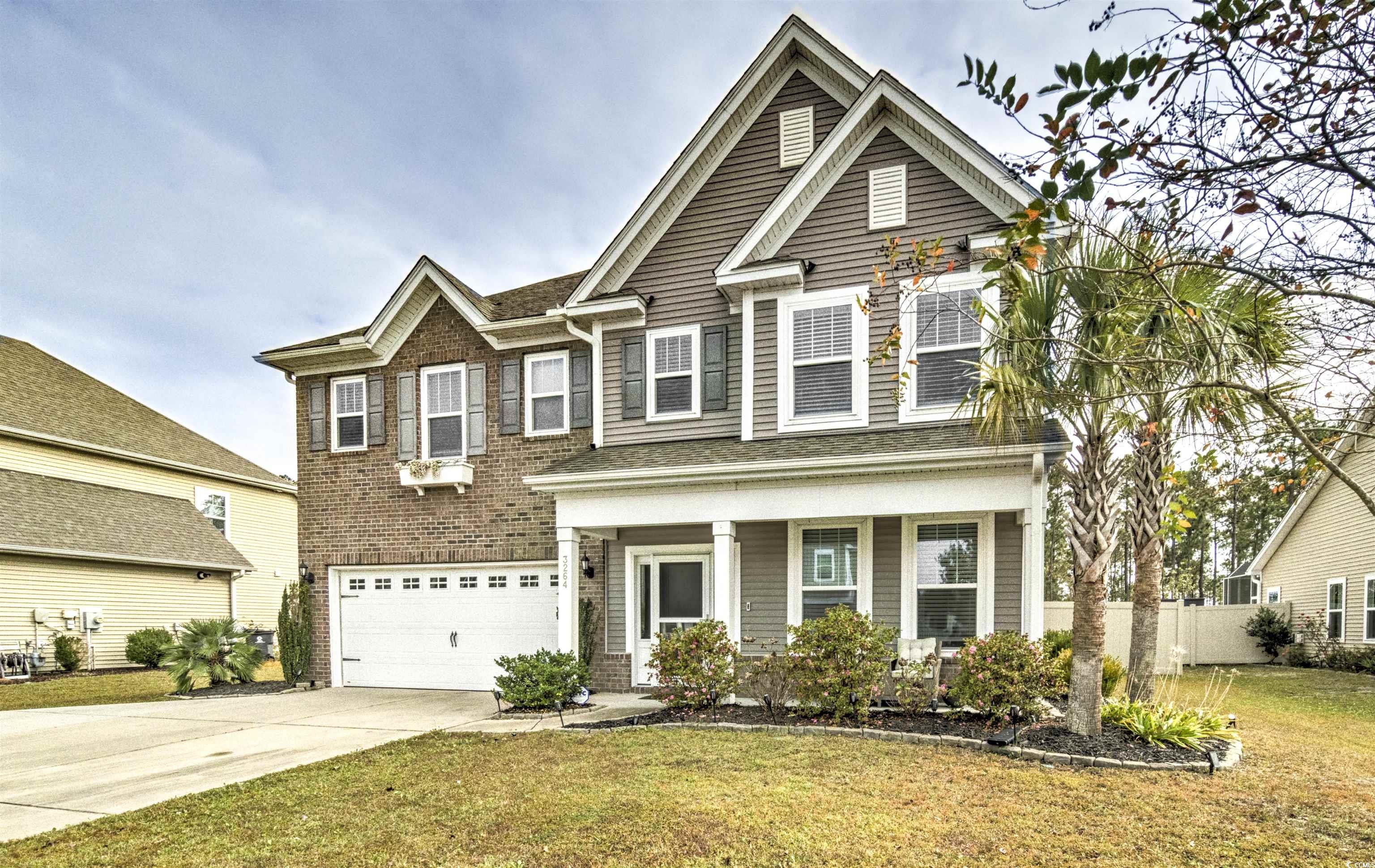 Craftsman inspired home with a garage, a front yar