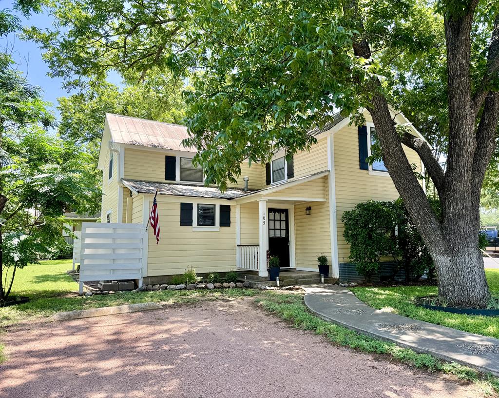 a view of a house with a yard