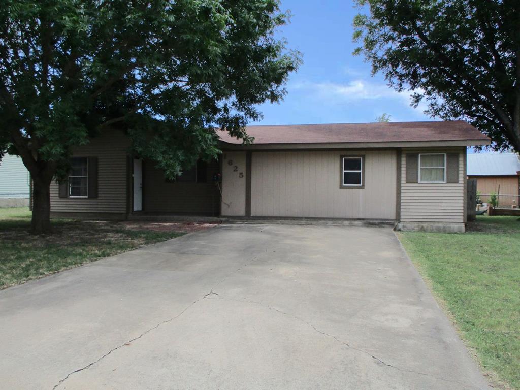 a house with a tree in front of it