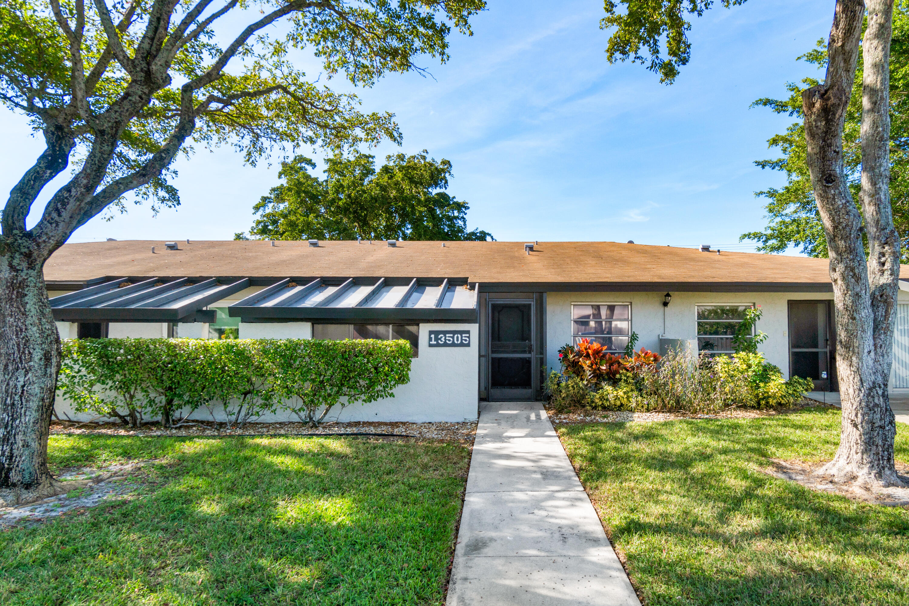 front view of a house with a yard