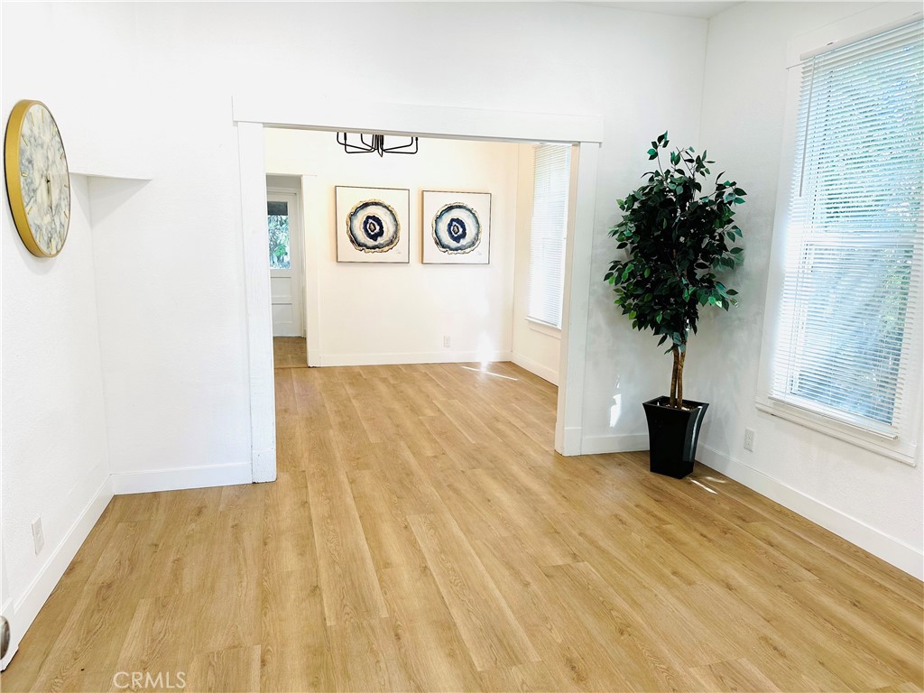 a view of washer and dryer with wooden floor