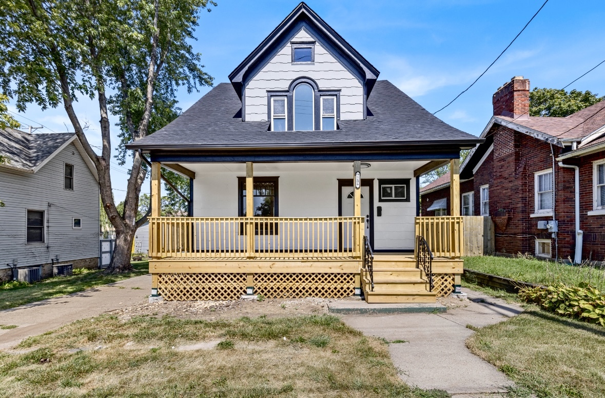 a front view of a house with a small yard