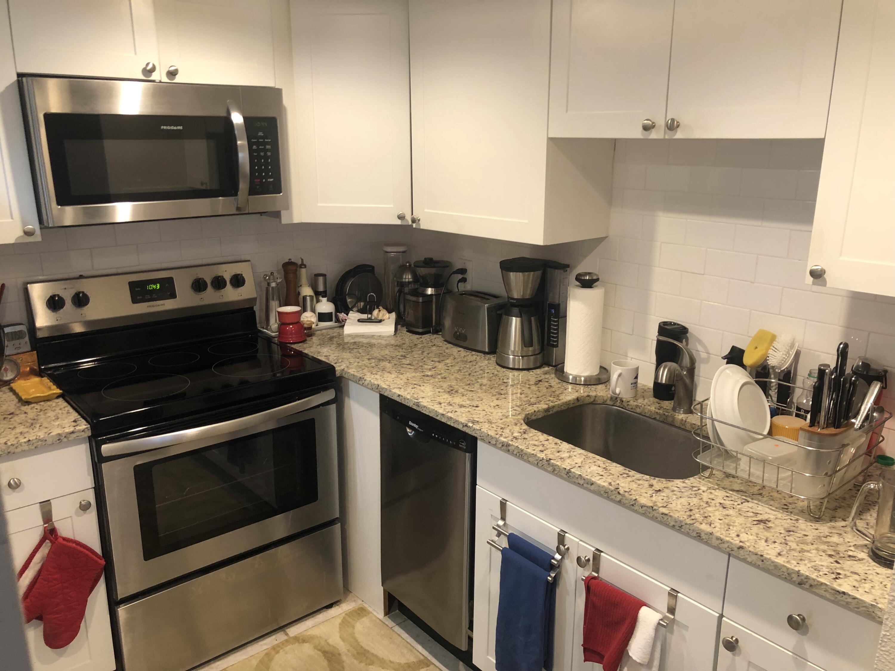 a kitchen with a stove and a microwave