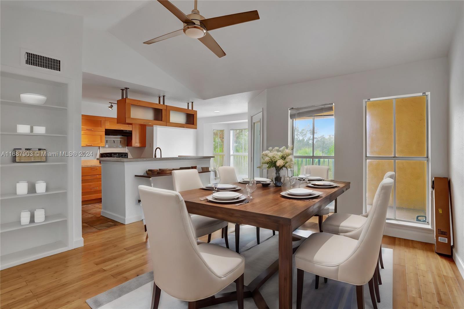 a view of a dining room with furniture and wooden floor