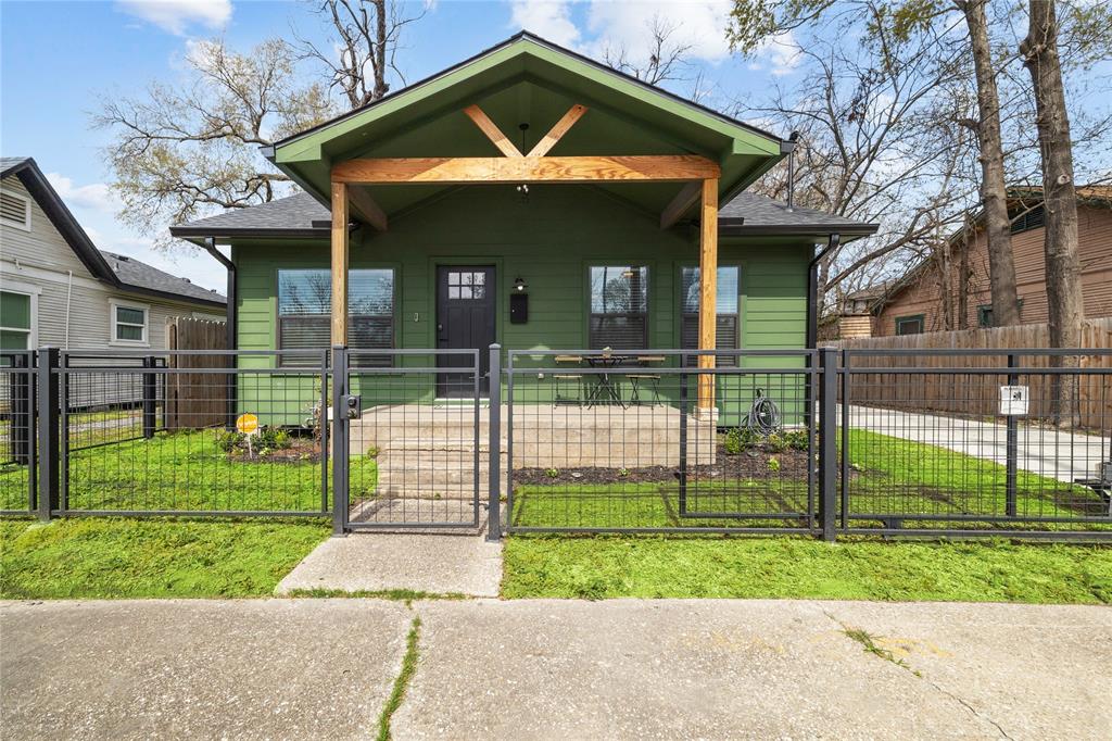 a front view of a house with a yard table and chairs