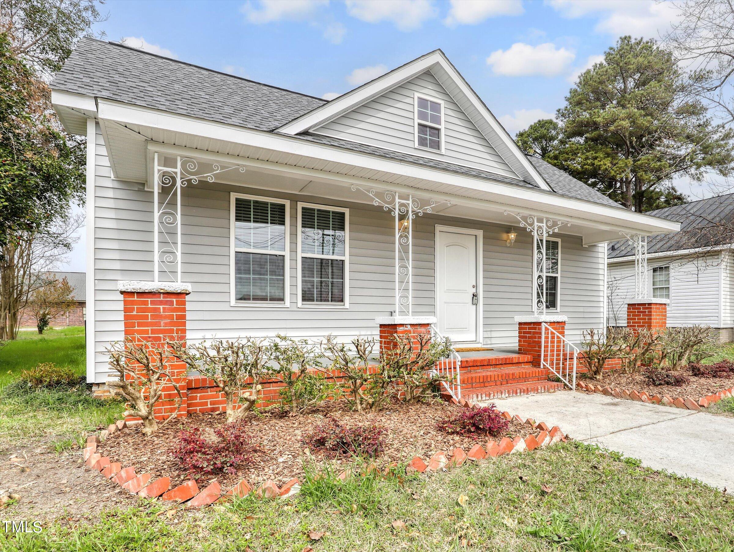 front view of a house with a patio