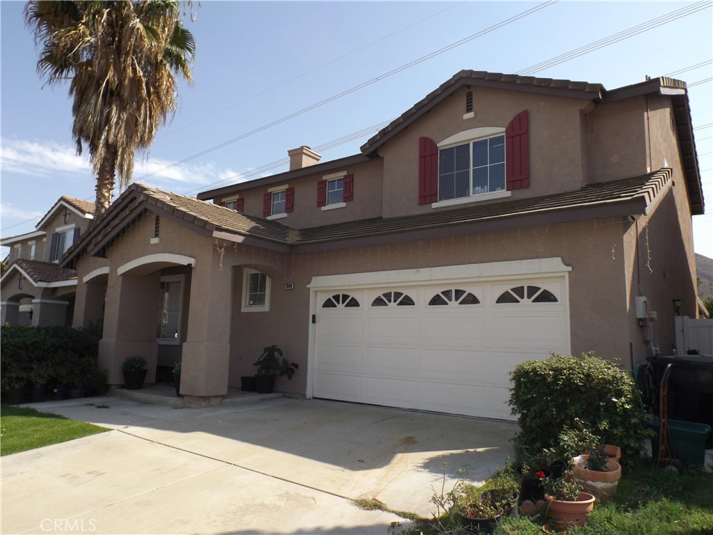 a front view of a house with a garage