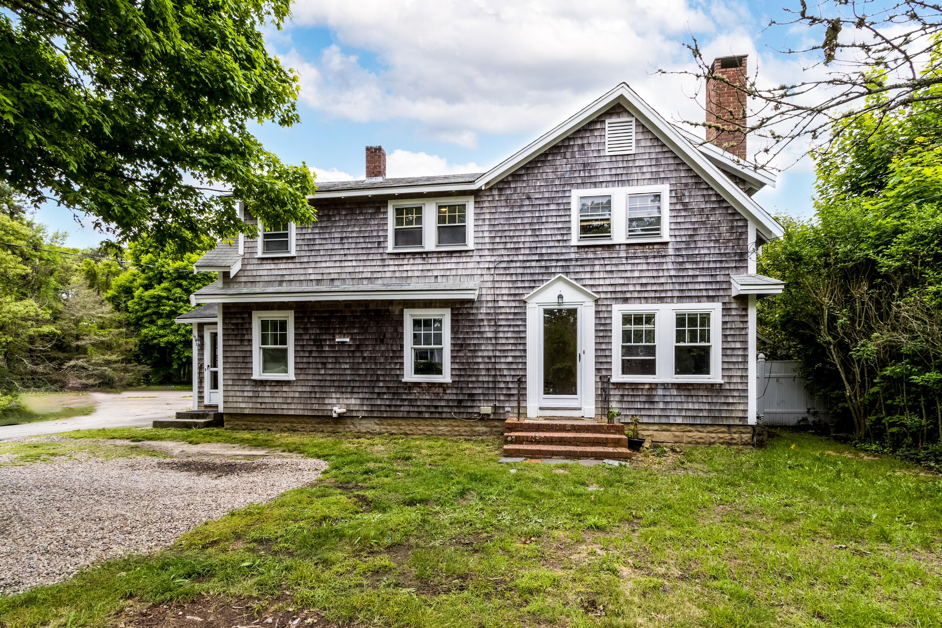 a front view of a house with garden